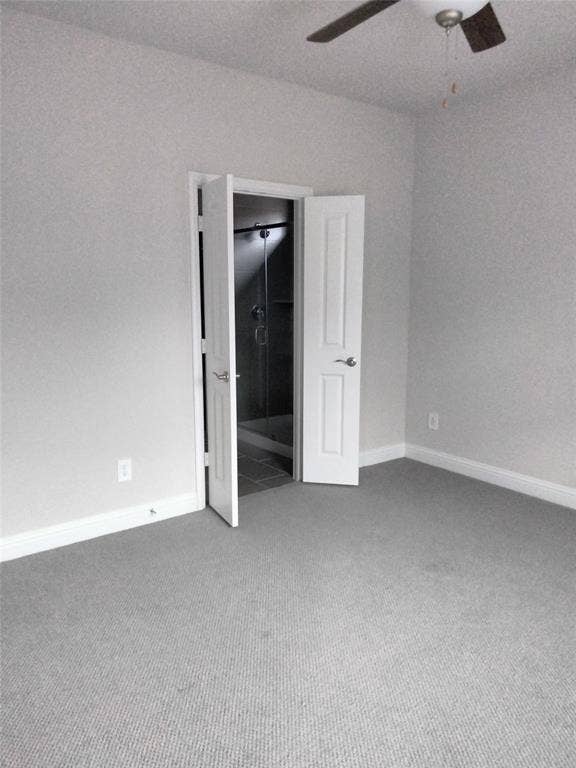 601 Willet Drive, McKinney, TX 75069 Carpeted flooring, light gray wall paint, white trim, ceiling fan, and an open doorway to a tiled shower area