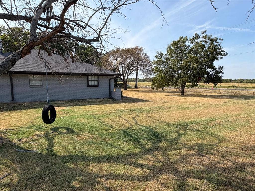 2928 Almeta Lane, McKinney, TX 75069 Expansive lawn with mature trees and a fenced perimeter