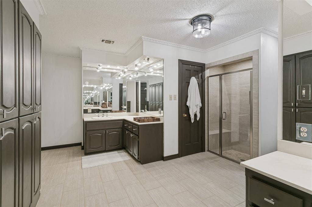 6801 Bellaire Court S, Benbrook, TX 76132 Dual vanity with integrated sinks, walk in shower, and task lighting
