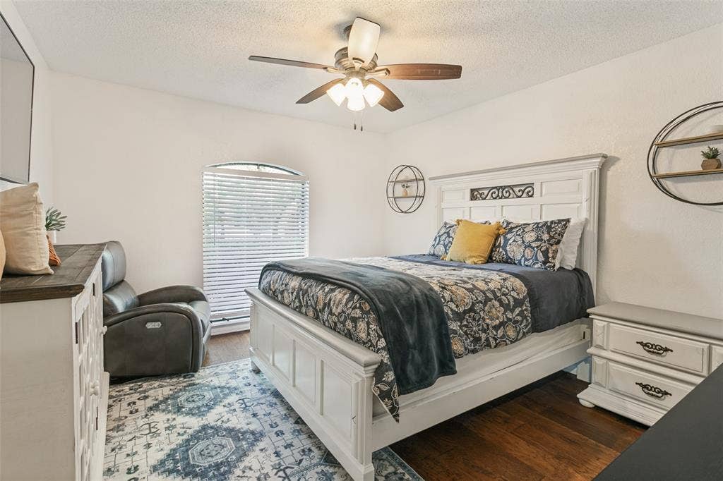 6801 Bellaire Court S, Benbrook, TX 76132 Wood-finish flooring, ceiling fan with integrated lighting in the front bedroom