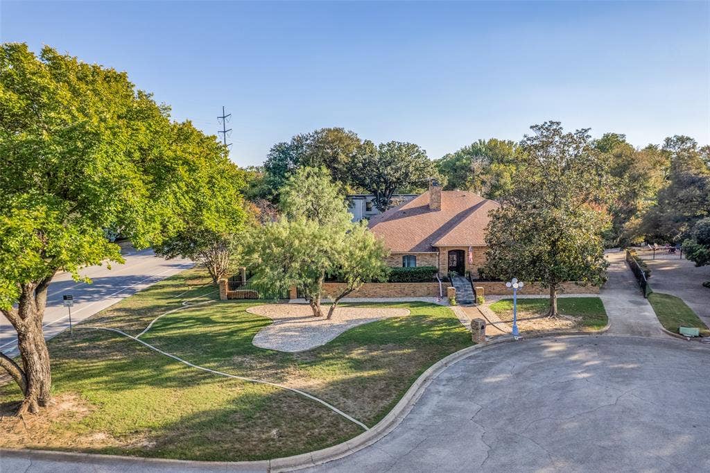 6801 Bellaire Court S, Benbrook, TX 76132 Aerial view showcases mature landscaping, paved driveway, and established trees