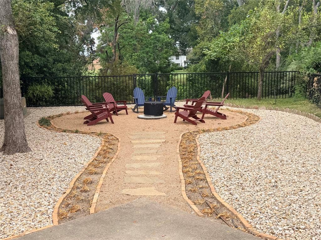 6801 Bellaire Court S, Benbrook, TX 76132 Gravel patio with a central fire pit area located at rear of the property overlooking branch of the Trinity River
