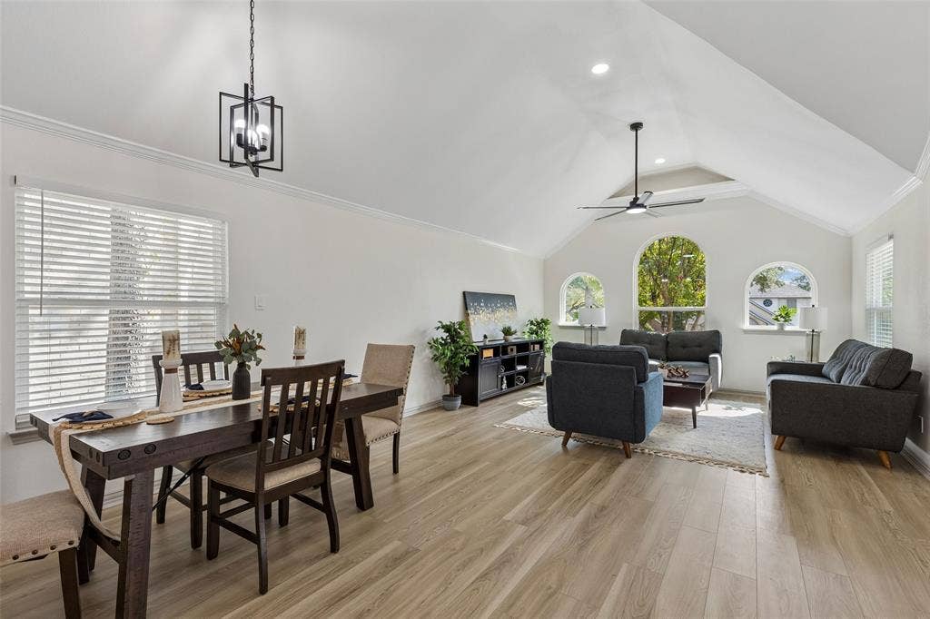 1503 Milla Court, Euless, TX 76039 Vaulted ceilings with recessed lighting, wood-finish flooring, three arched windows, and a modern ceiling fan