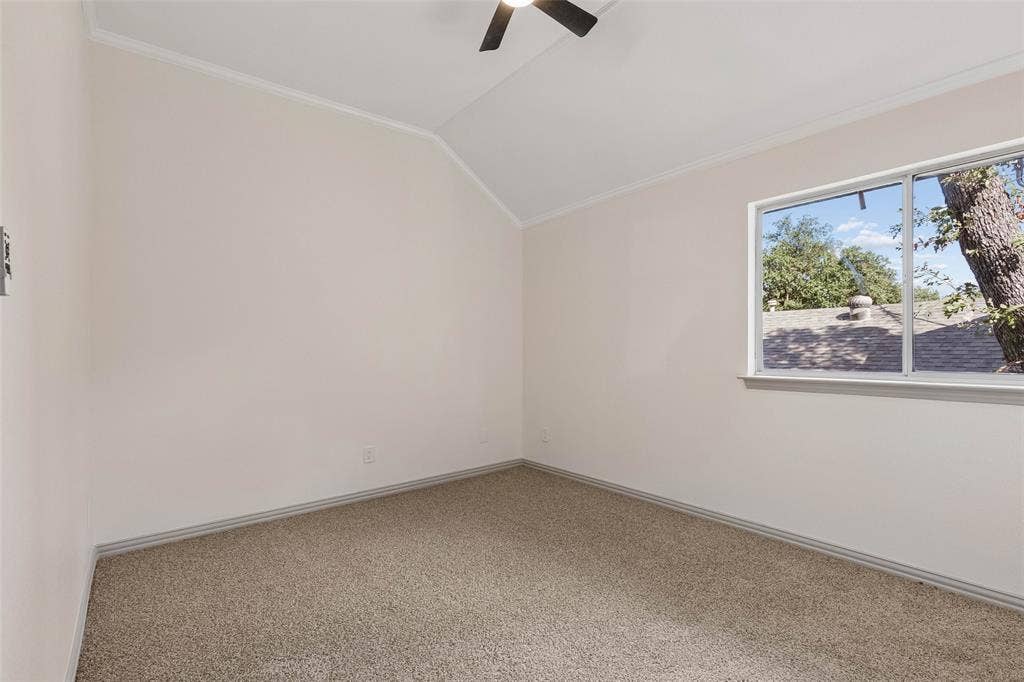 1503 Milla Court, Euless, TX 76039 Vaulted ceiling, carpeted flooring, ceiling fan, and a large window