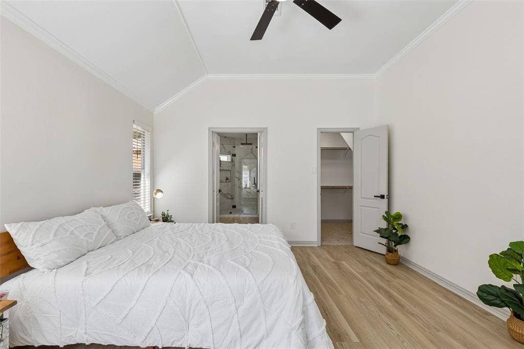 1503 Milla Court, Euless, TX 76039 Vaulted ceiling, wood-finish flooring, ceiling fan, walk-in closet, and glass-enclosed shower
