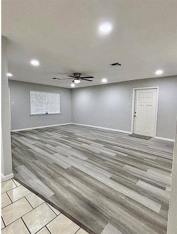 2115 N 9th Street, Temple, TX 76501 Spacious room featuring wood-finish flooring, recessed lighting, and a ceiling fan