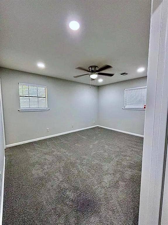 2115 N 9th Street, Temple, TX 76501 Recessed ceiling lighting, ceiling fan, neutral wall paint, window blinds, and gray carpeting