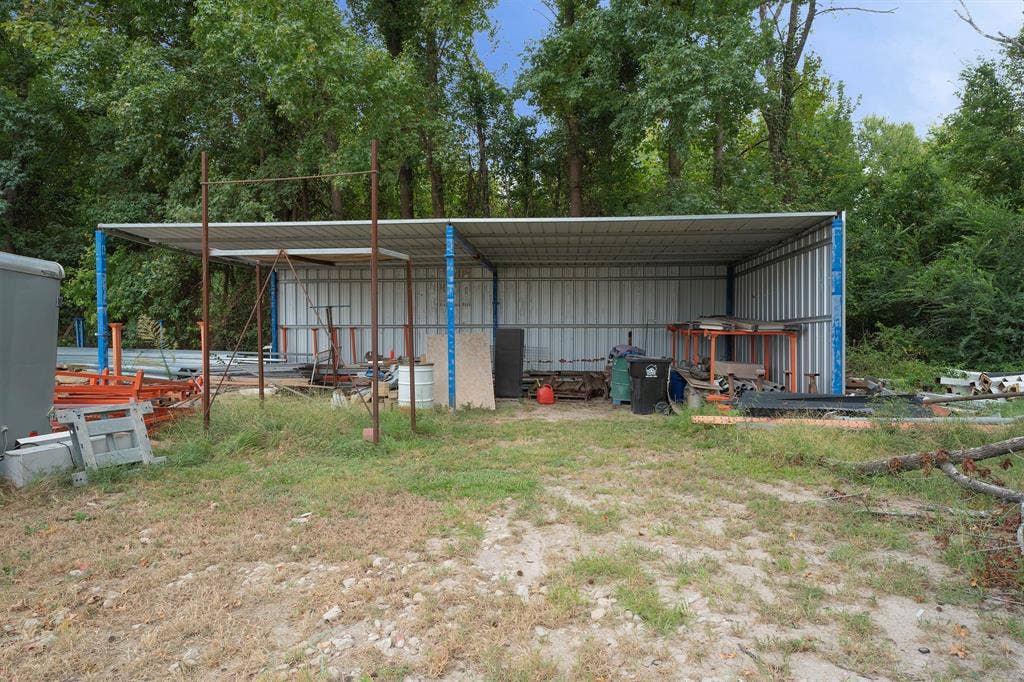 5989 State Highway 31 E, Murchison, TX 75778 Covered storage structure with metal panel walls and roof