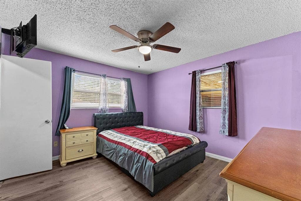 5989 State Highway 31 E, Murchison, TX 75778 Wood-finish flooring with a ceiling-mounted fan fixture