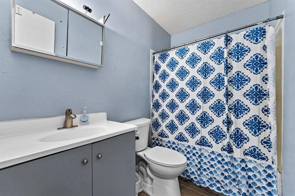 5989 State Highway 31 E, Murchison, TX 75778 Vanity with integrated sink, sleek faucet, and under-cabinet storage