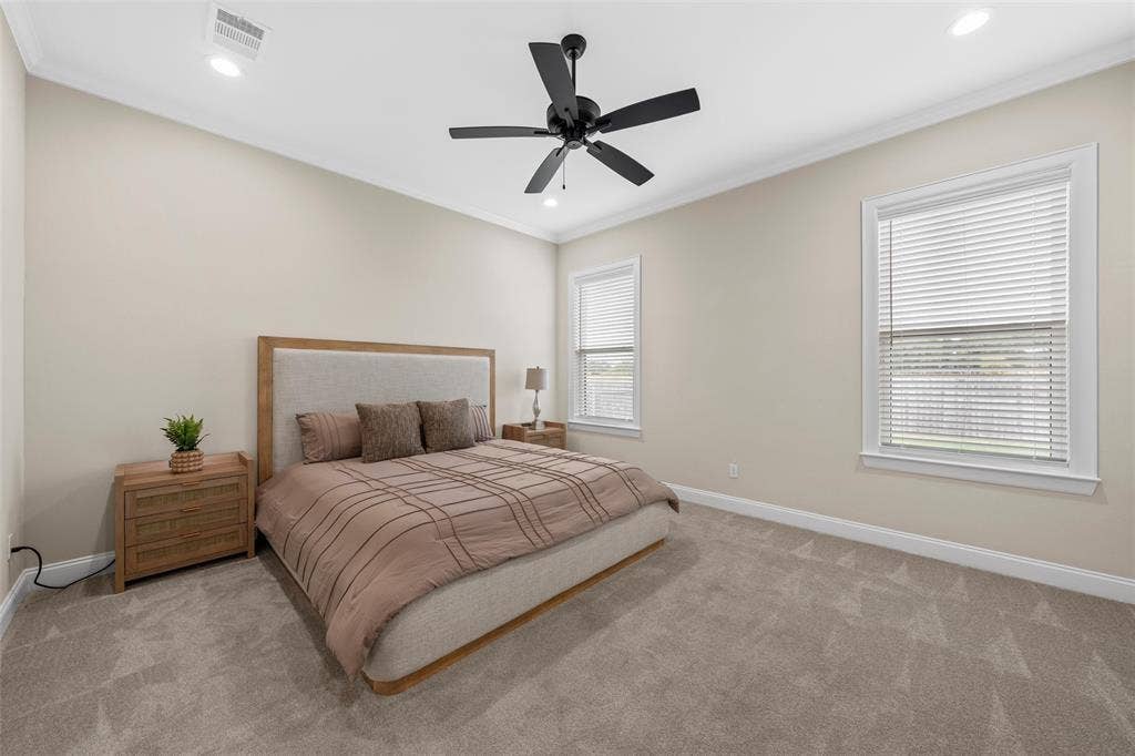 10201 Castleberry Lane, Waco, TX 76712 Recessed lighting, crown molding, and two windows with blinds