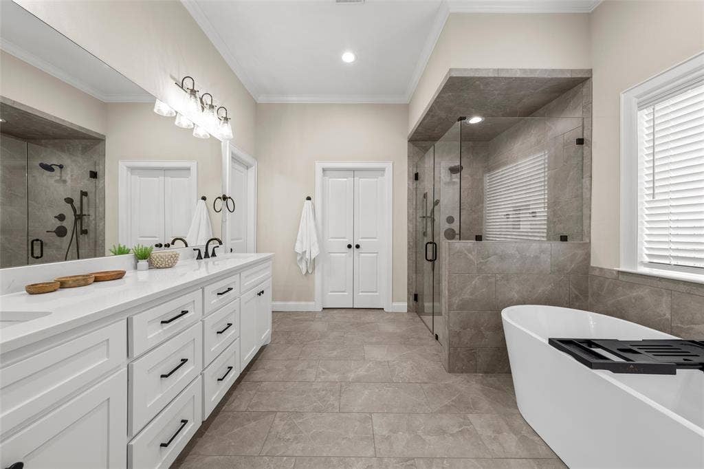 10201 Castleberry Lane, Waco, TX 76712 Dual vanity with white cabinetry and black hardware