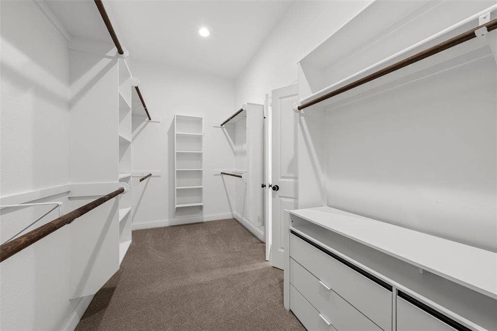 10201 Castleberry Lane, Waco, TX 76712 Walk-in closet with built-in shelving, hanging rods, and integrated drawers