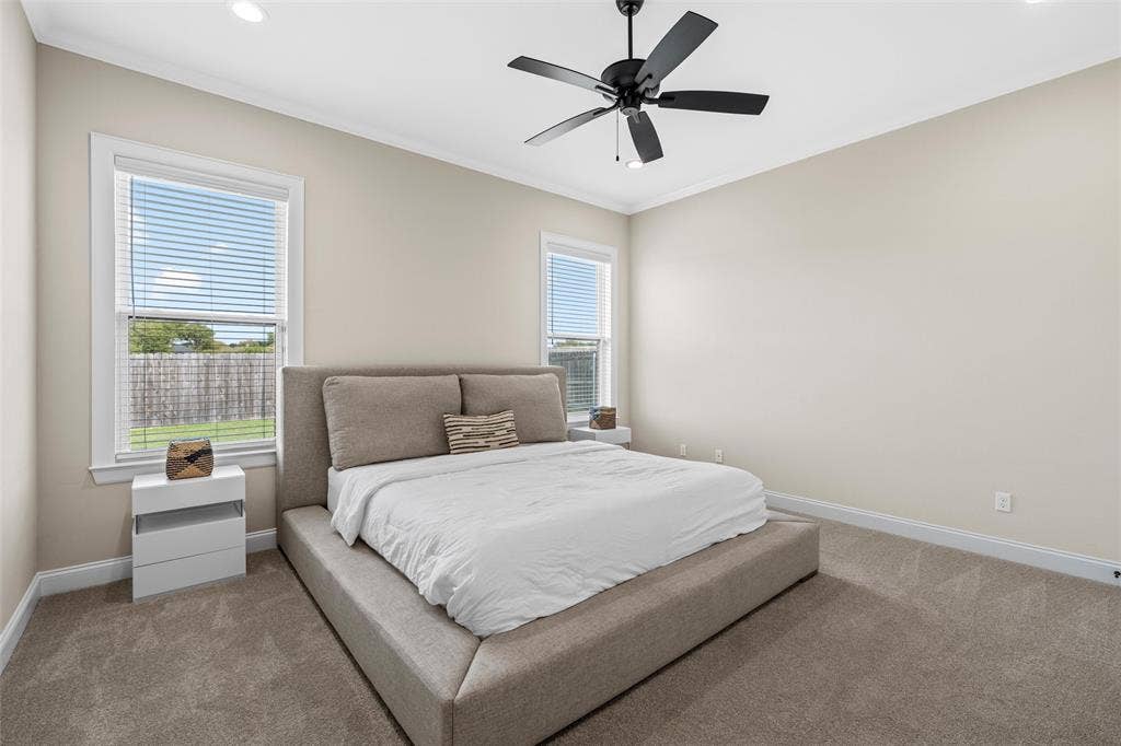 10201 Castleberry Lane, Waco, TX 76712 Recessed lighting, crown molding, and neutral wall paint