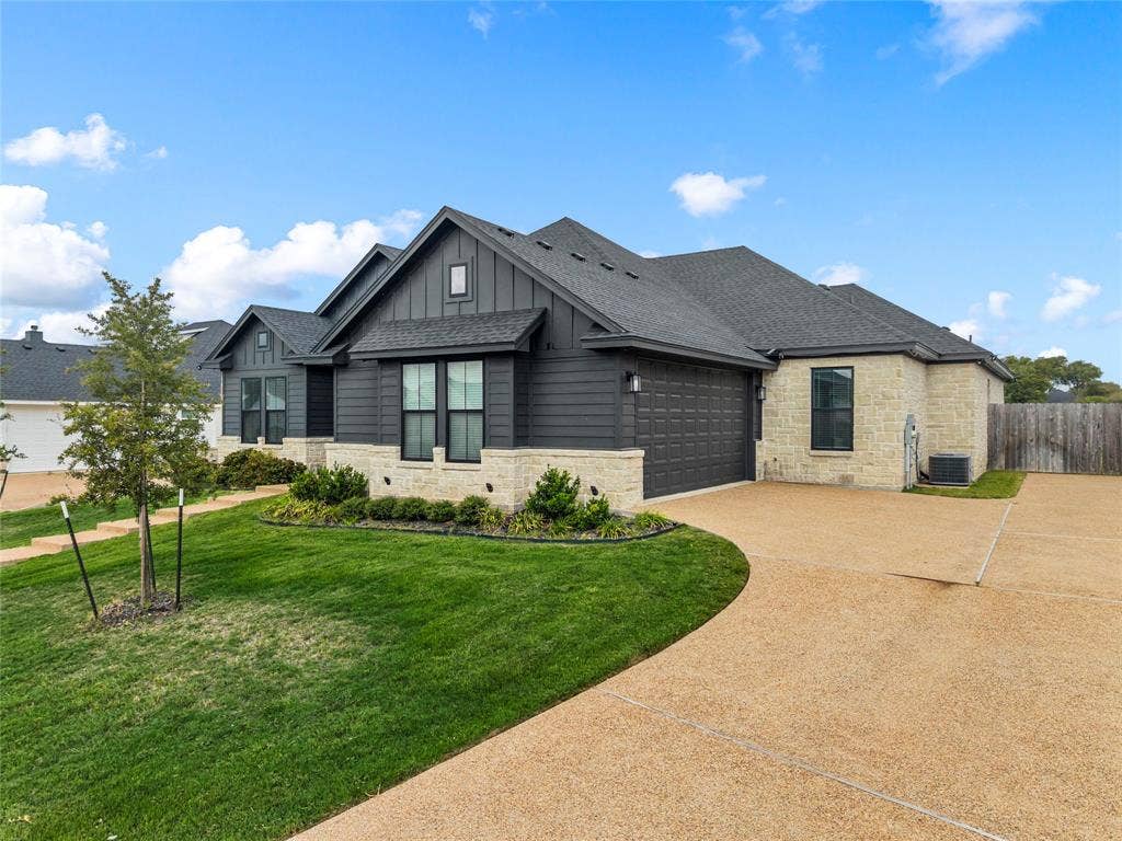 10201 Castleberry Lane, Waco, TX 76712 Contemporary exterior featuring stone and horizontal siding