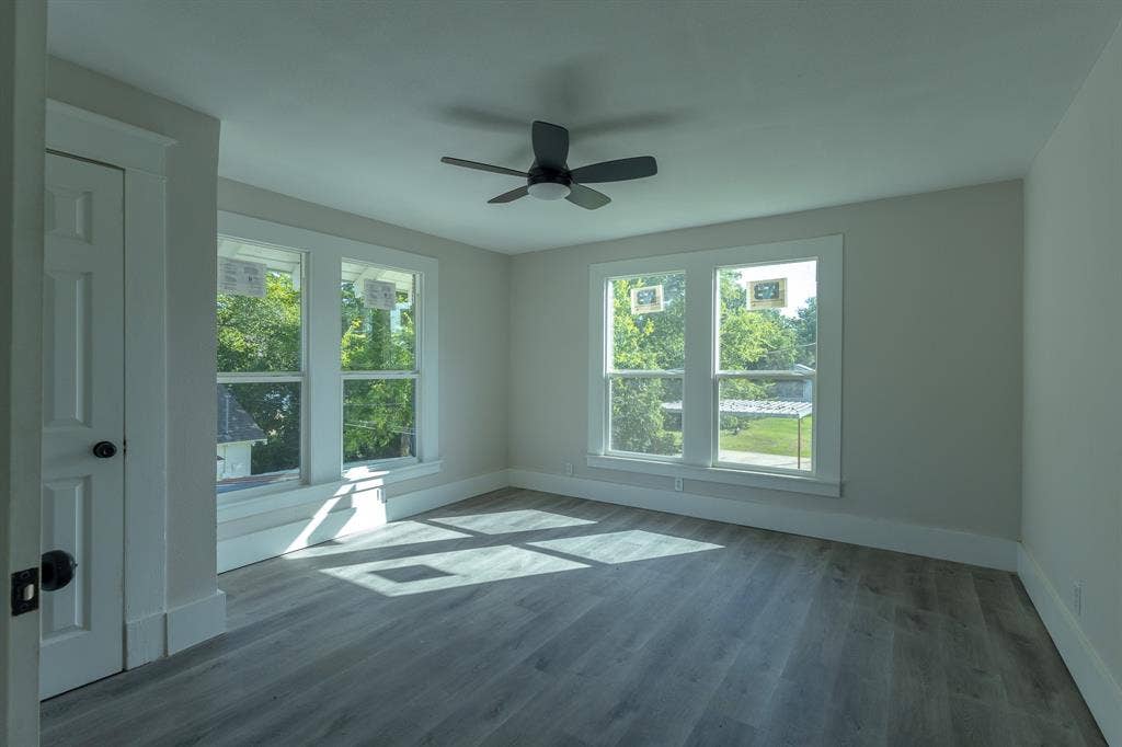 1702 Ethel Avenue, Waco, TX 76707 Wood-finish flooring with crisp white trim