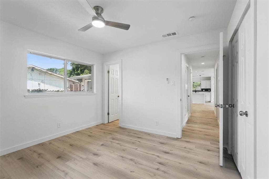 810 Greenhaven Drive, Richardson, TX 75080 Primary Bedroom with en suite bath and double closets.