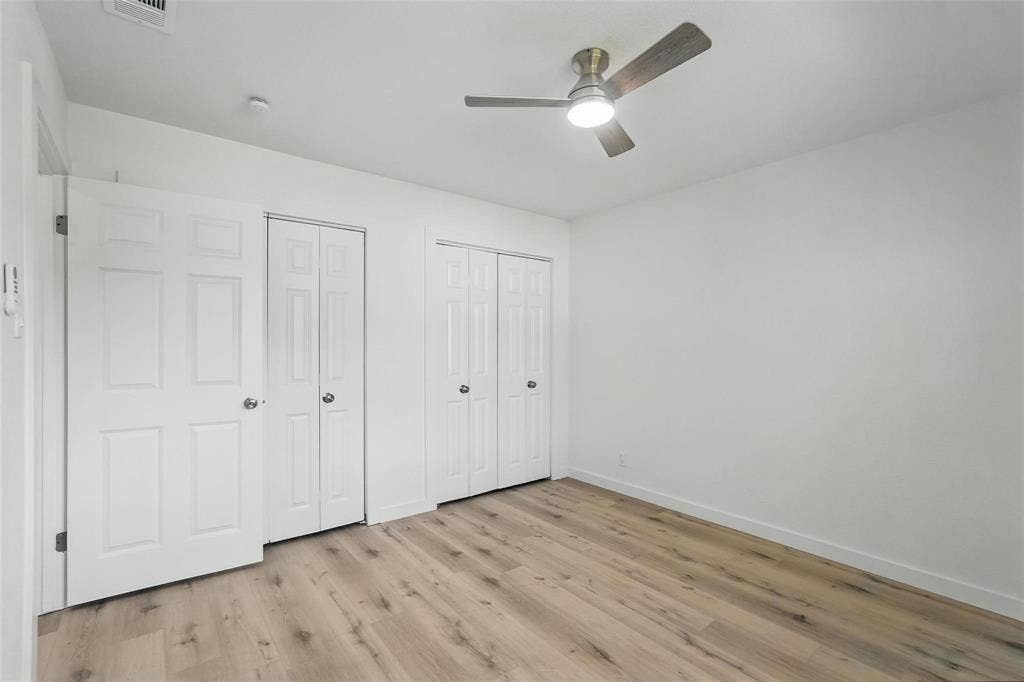 810 Greenhaven Drive, Richardson, TX 75080 Primary Bedroom with en suite bath and double closets.