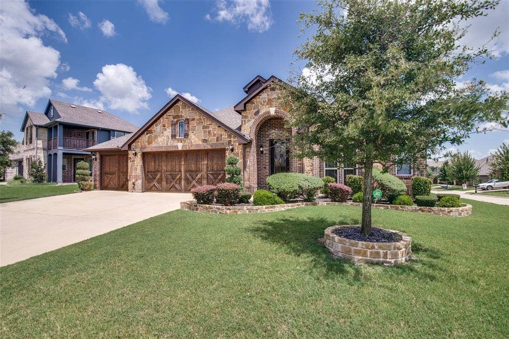 1813 Chadwick Lane, Forney, TX 75126 Stone and brick exterior with arched entryway