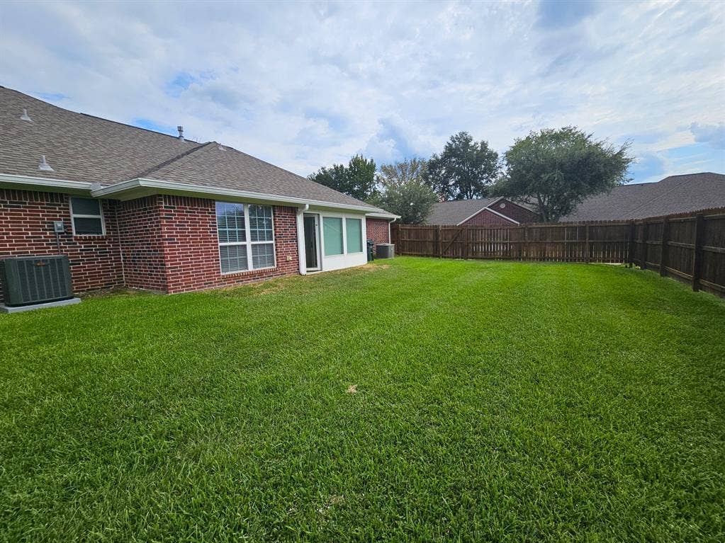 1521 Rice Road, #Z-101, Tyler, TX 75703 Entry hall featuring tile flooring, crown molding, chair rail molding, and a pendant light fixture