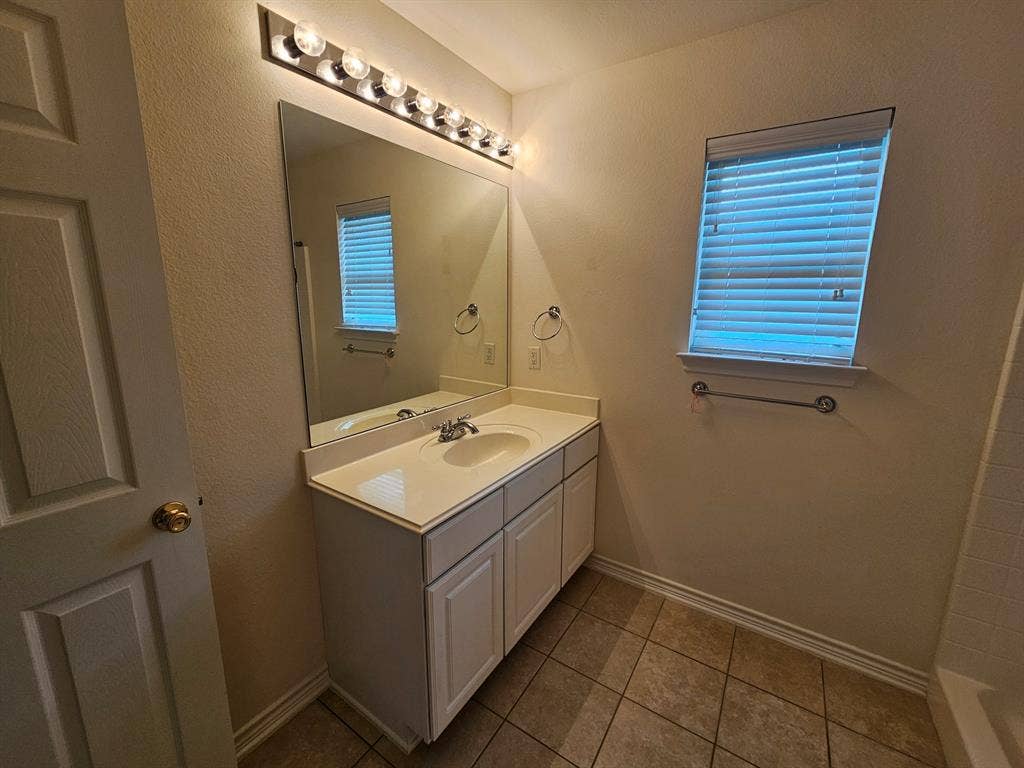 1521 Rice Road, #Z-101, Tyler, TX 75703 Bathroom vanity with a single basin sink and chrome faucet