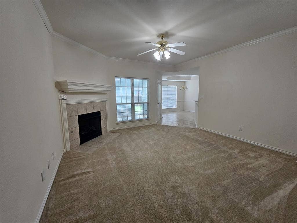 1521 Rice Road, #Z-101, Tyler, TX 75703 Kitchen featuring wood cabinetry, white countertops, tile flooring, and integrated appliances