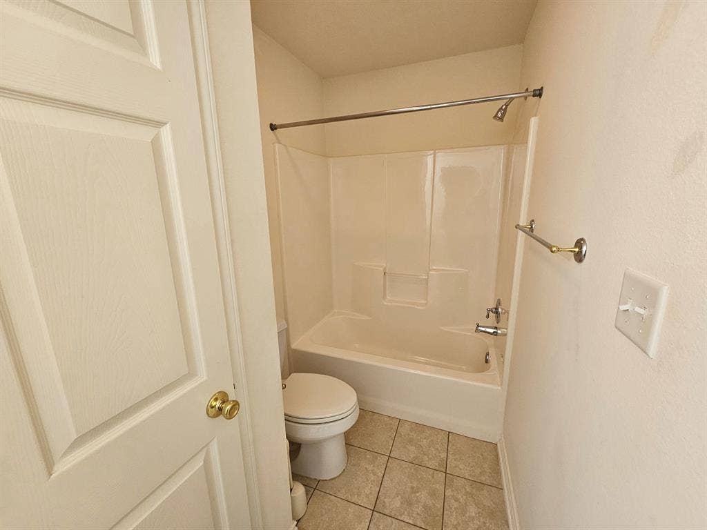 1521 Rice Road, #Z-101, Tyler, TX 75703 White paneled door with a brass knob
