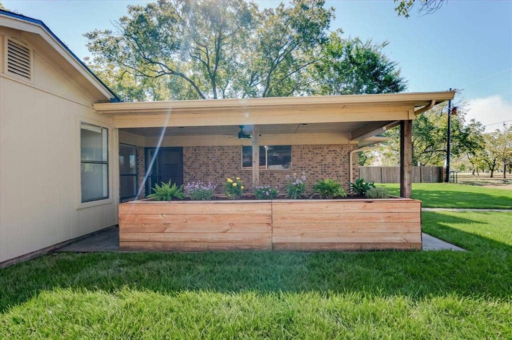 Backyard with raised flower bed.