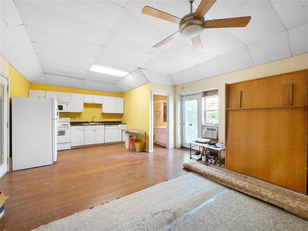 2944 CR-596, Nevada, TX 75173 Kitchen area with white cabinetry and appliances