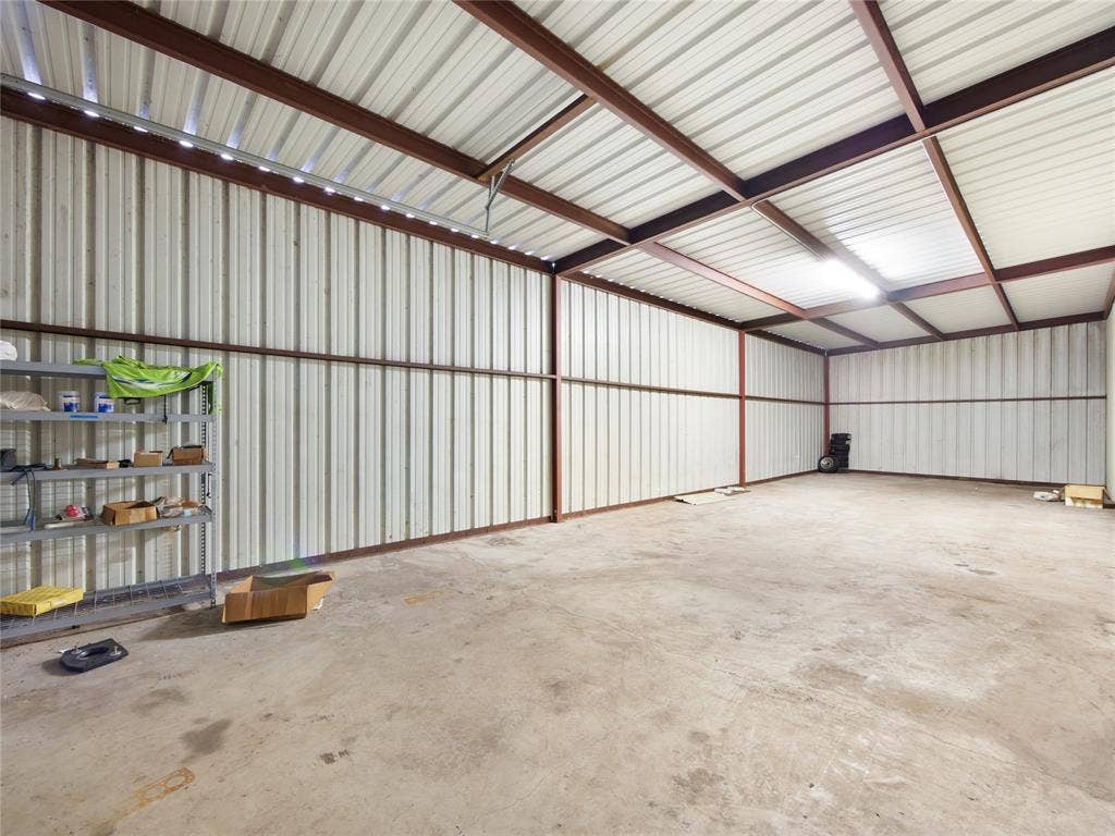 2944 CR-596, Nevada, TX 75173 Expansive interior with concrete flooring and corrugated metal walls