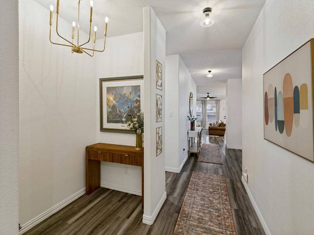 5513 Baker Creek Road, Fort Worth, TX 76126 Entryway featuring wood-finish flooring, a contemporary gold chandelier, and recessed lighting