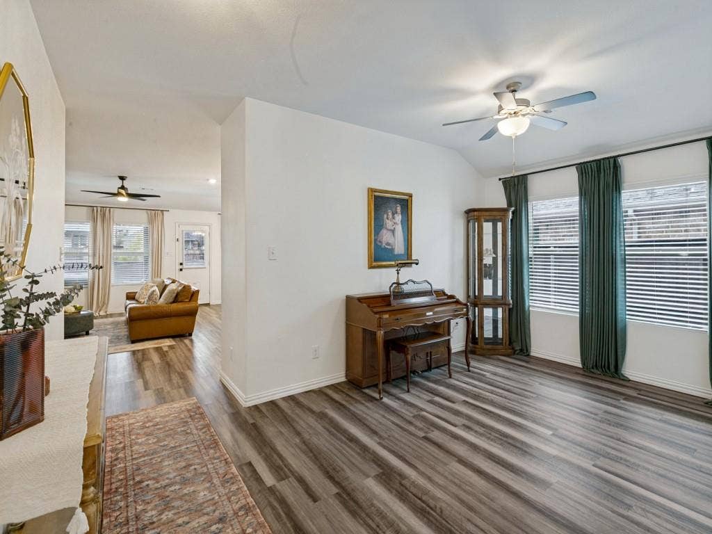 5513 Baker Creek Road, Fort Worth, TX 76126 Vaulted ceilings in the living area and wood-finish flooring throughout