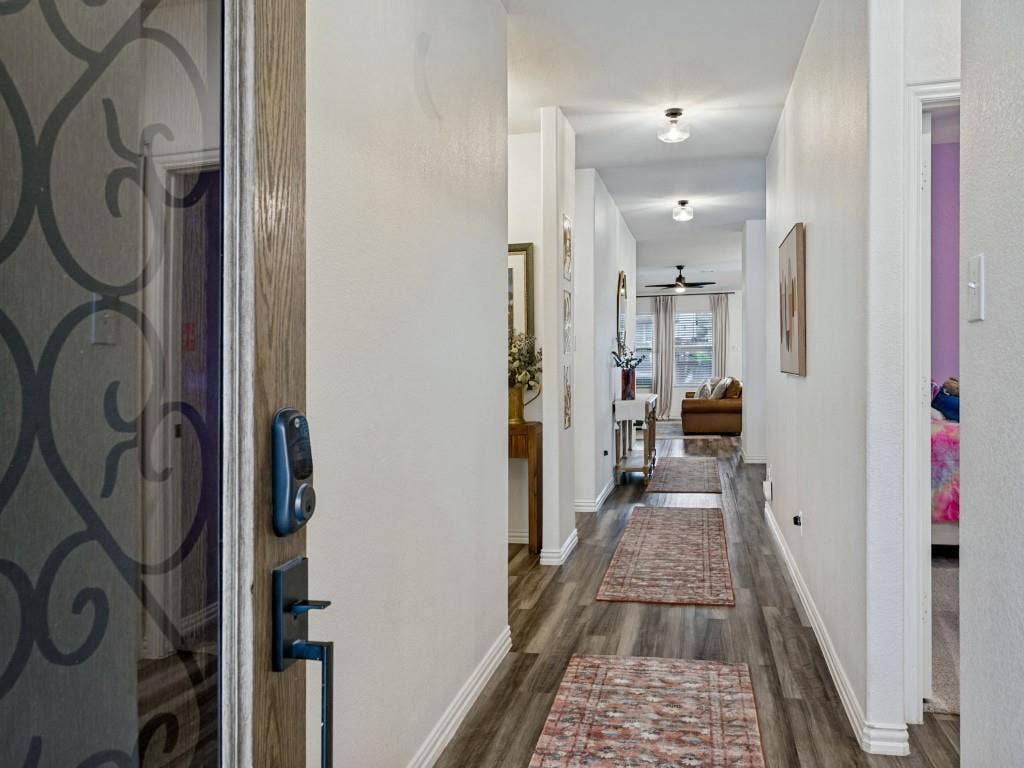 5513 Baker Creek Road, Fort Worth, TX 76126 Entryway featuring a decorative glass door, digital door lock, wood-finish flooring, and recessed lighting
