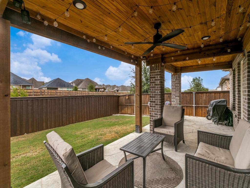 5513 Baker Creek Road, Fort Worth, TX 76126 Covered patio with a wood-finish plank ceiling, recessed lighting, and a ceiling fan