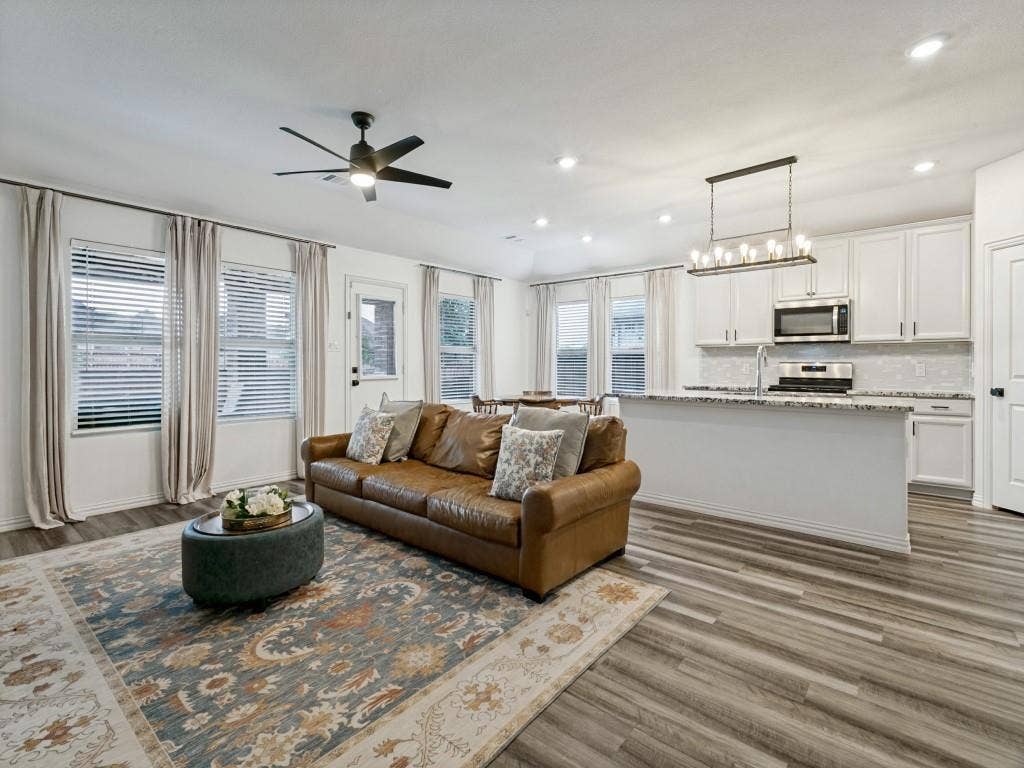 5513 Baker Creek Road, Fort Worth, TX 76126 Open-concept living area featuring wood-finish flooring, recessed lighting, and a ceiling fan
