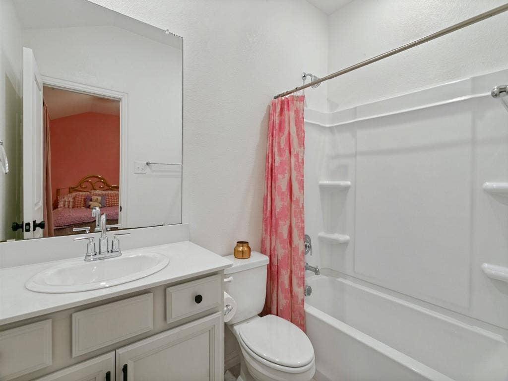 5513 Baker Creek Road, Fort Worth, TX 76126 White vanity with an integrated sink and chrome faucet