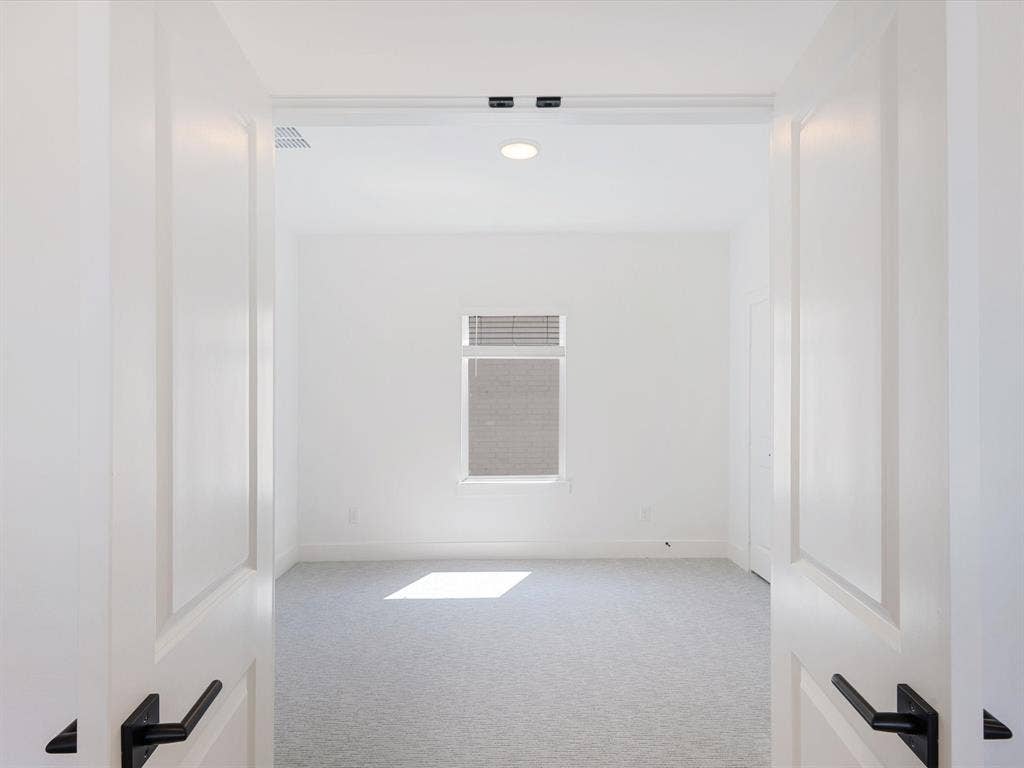 2317 Peters Colony Drive, Little Elm, TX 75036 Spare room featuring light carpet and recessed lighting