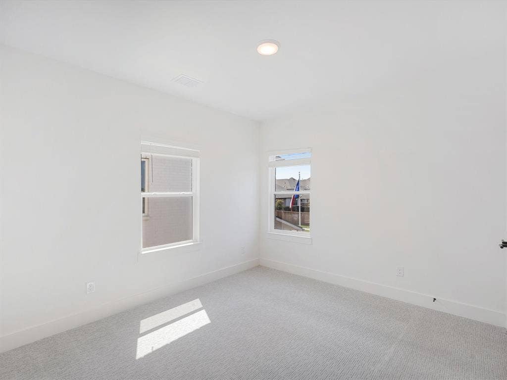 2317 Peters Colony Drive, Little Elm, TX 75036 Empty room with carpet and recessed lighting