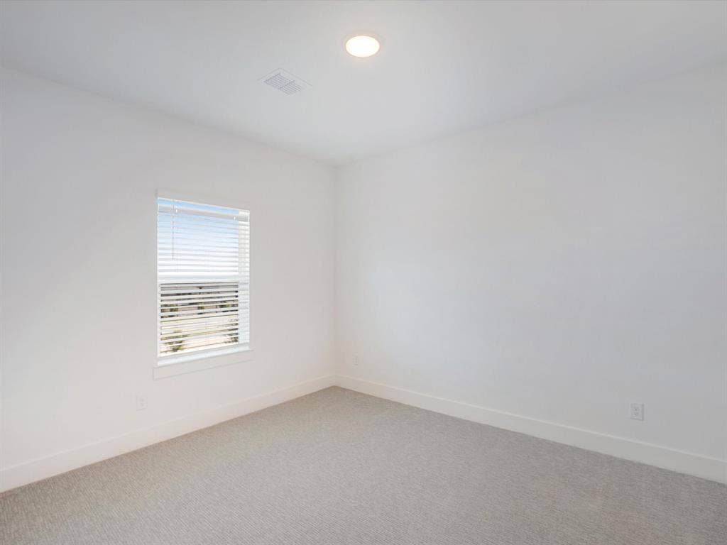 2317 Peters Colony Drive, Little Elm, TX 75036 Carpeted empty room with baseboards