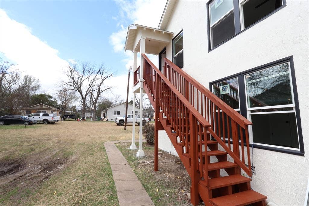 1704 Ethel Avenue, #B, Waco, TX 76707 Exterior staircase with wood-finish railings and treads