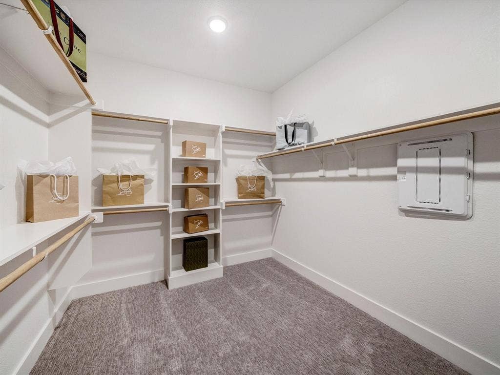 2313 Peters Colony Drive, Little Elm, TX 75036 Spacious closet featuring light colored carpet