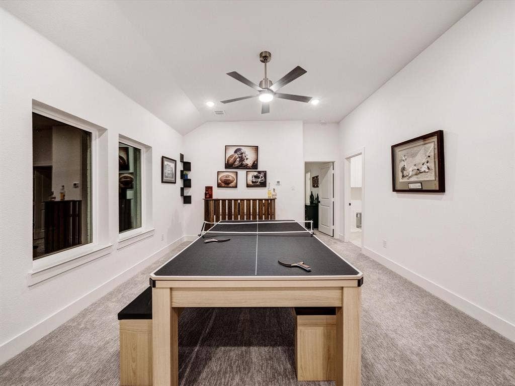 2313 Peters Colony Drive, Little Elm, TX 75036 Playroom featuring light colored carpet, vaulted ceiling, a ceiling fan, and recessed lighting