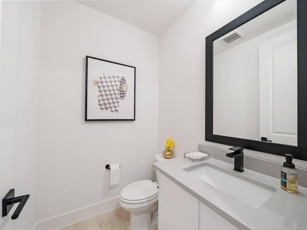 2313 Peters Colony Drive, Little Elm, TX 75036 Bathroom with vanity and toilet