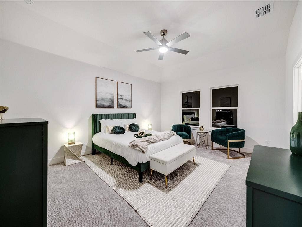 2313 Peters Colony Drive, Little Elm, TX 75036 Bedroom featuring carpet and a ceiling fan