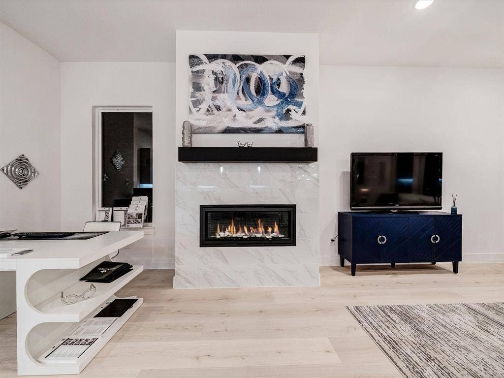 2313 Peters Colony Drive, Little Elm, TX 75036 Living room featuring a high end fireplace, light wood-style floors, and recessed lighting
