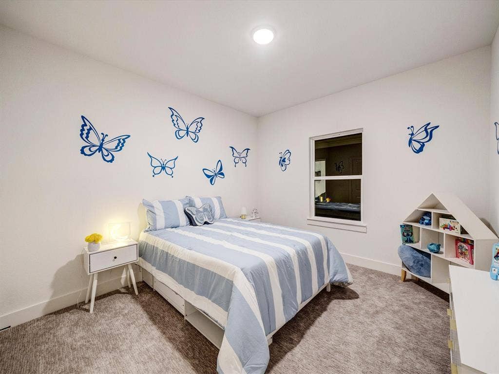 2313 Peters Colony Drive, Little Elm, TX 75036 Bedroom with light colored carpet