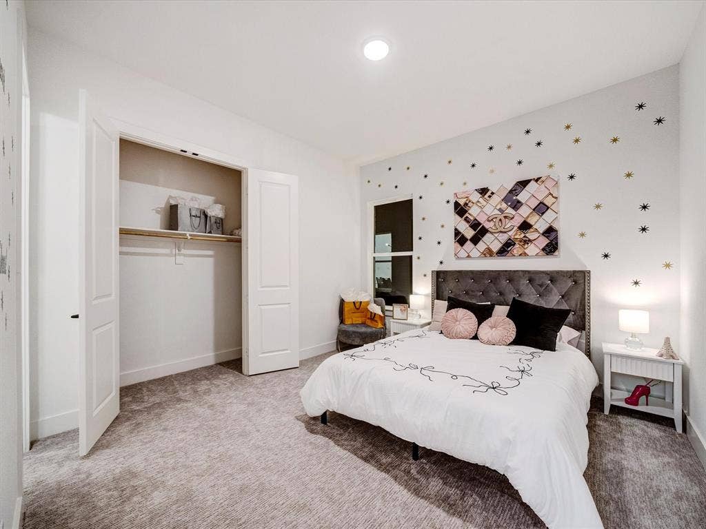 2313 Peters Colony Drive, Little Elm, TX 75036 Bedroom featuring carpet floors and a closet