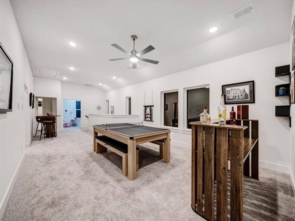 2313 Peters Colony Drive, Little Elm, TX 75036 Rec room with light carpet, lofted ceiling, a ceiling fan, and recessed lighting