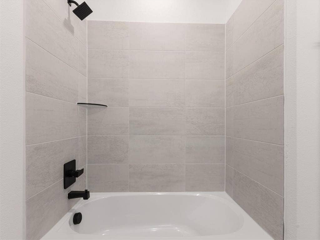 Ensuite bathroom featuring  shower combination