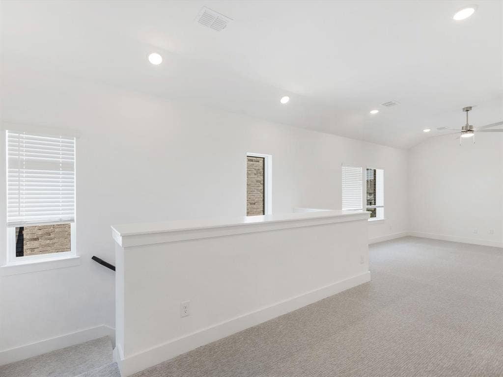 Game room featuring light colored carpet, recessed lighting, a ceiling fan, and lofted ceiling